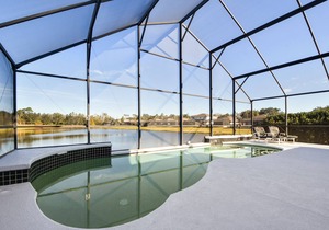 Stunning Lakefront 4 Bed 2.5 Bath Pool Home gated community 5 mi to Disney