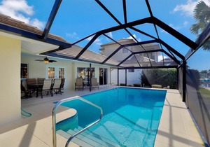 Stylish waterfront home w/ all-day sun & short walk to shopping & dining