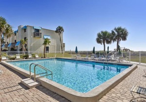 This beautifully remodeled beachfront town home Villa.