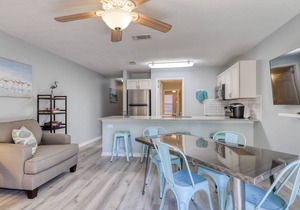 Trendy condo with full kitchen, shared pool, and easy beach access
