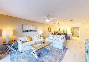 Updated 1st-floor condo with large private balcony, pool, grills, firepit, & gym