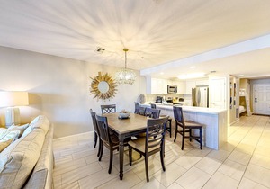 Updated 1st-floor condo with large private balcony, pool, grills, firepit, & gym