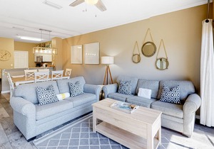 Updated, beachside condo with dual suites, balcony & pool - walkable locale