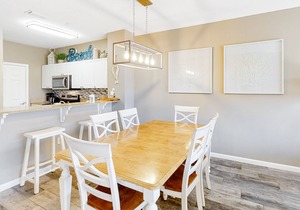 Updated, beachside condo with dual suites, balcony & pool - walkable locale