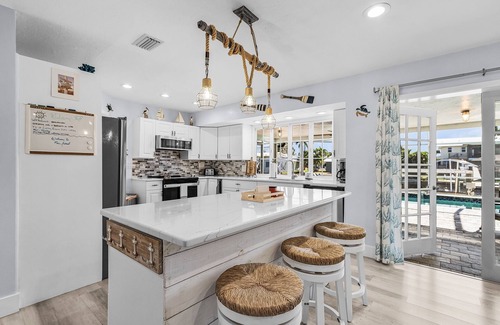 Saint James City House | 2/2 Pool Home on the Water, Boat Lift Included!