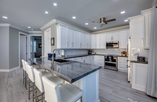 Mid Island House | 251 Key West Court: HUGE Luxe Beachfront Pool Home Steps from the Sand