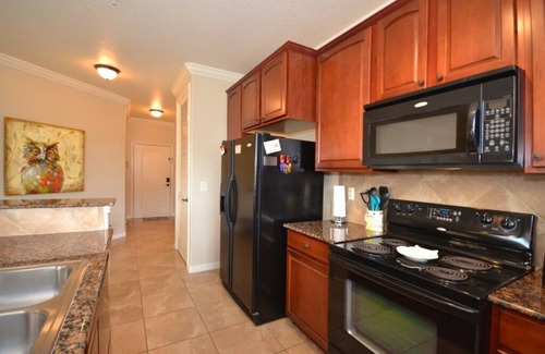 Regal Palms Condo | Bright condo with south facing balcony overlooking pond