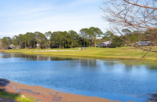 Laurel Grove House | Charming Cottage w/Lake Views, Golf Cart, Beach Tram, Tropical Pool, Hot Tub.