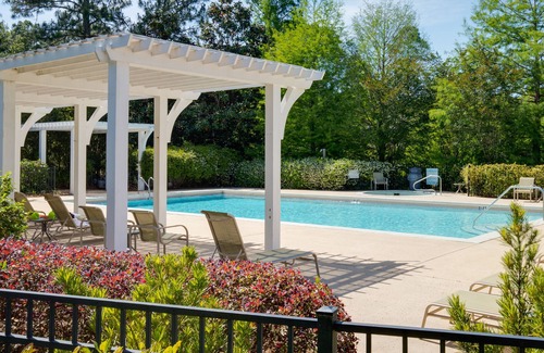 Laurel Grove House | Charming Cottage w/Lake Views, Golf Cart, Beach Tram, Tropical Pool, Hot Tub.