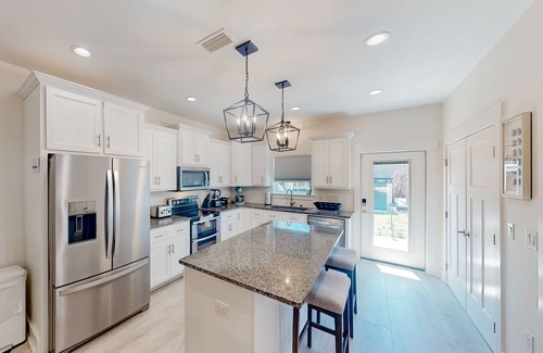 Holiday Beach House | Coastal-chic escape with bikes, enclosed backyard/shaded patio & Big Green Egg