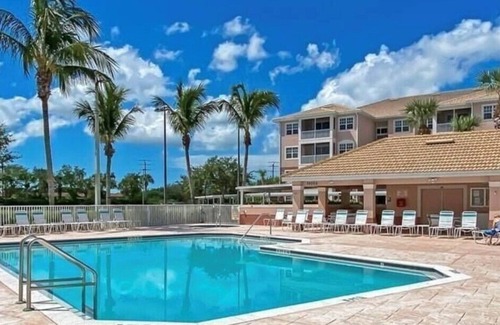 Majestic Palms Condo | Condo 3miles from beach Pool Highly desired elevator gated Disc for Displaced Sr