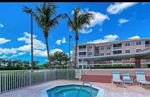 Majestic Palms Condo | Condo 3miles from beach Pool Highly desired elevator gated Disc for Displaced Sr
