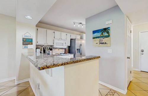 Butler Beach Condo | Garden-level condo with patio, 2 pools, gym, tennis & sauna - steps to the beach