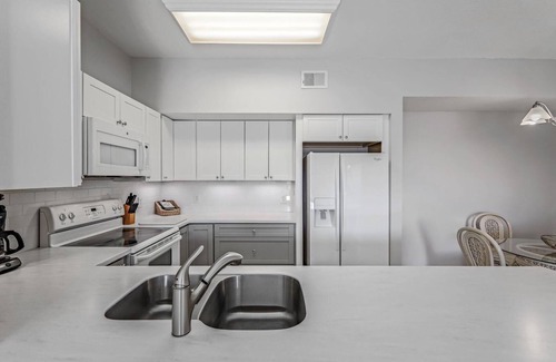 Iona Condo | Gardens at Beachwalk Close To Beaches; Walking Distance To Shops & Restaurants