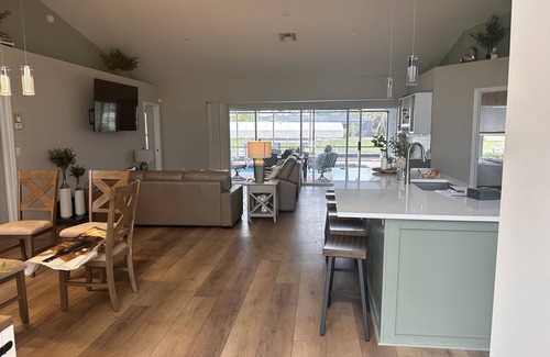 Caloosahatchee House | Gulf access water views while baking pizza on the lanai or riding the peloton!