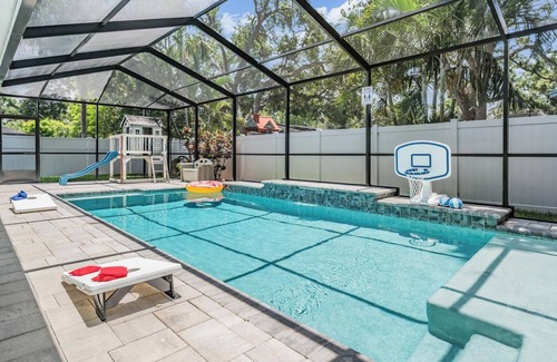Beach Park House | Heated pool, arcade, 6 TVs, 4-bedroom house with AC, WiFi in brilliant Tampa