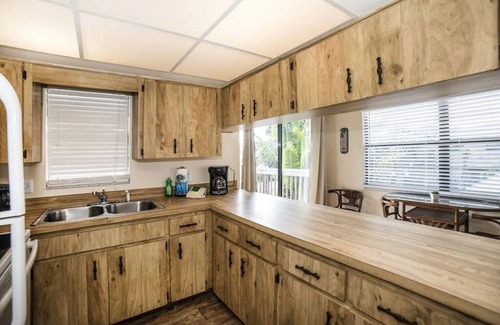 Indian Rocks Beach Apartment | Just 1 block from the sugar white sand beach. Charming 2 bedroom Beach suite with large private deck . Walk To Restaurants, Shops And The Beach