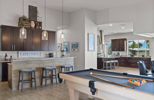 Yacht Club House | Luxury home w/2 suites, LARGE pool, spa, lanai. Quick gulf access! 5 Bikes! EV!