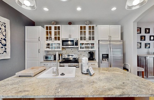 New Smyrna Beach House | Manicured home & pool house w/private pool - short walk to the ocean