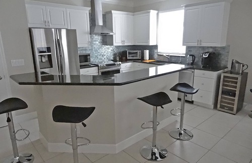 Naples Park House | Modern villa, short walk to the beach, screened heated pool