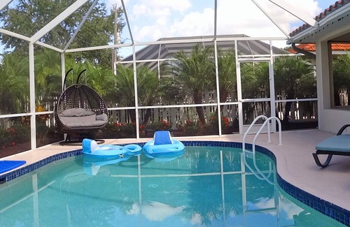 Naples Park House | Modern villa, short walk to the beach, screened heated pool