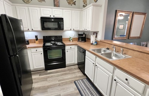 West Kissimmee Condo | Oakwater Resort, Two Miles to Disney, Lake View, Relax in our Hot Tub and Pool!