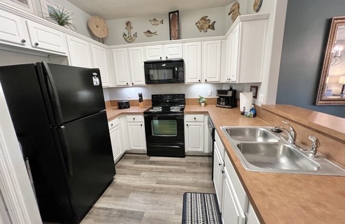 West Kissimmee Condo | Oakwater Resort, Two Miles to Disney, Lake View, Relax in our Hot Tub and Pool!