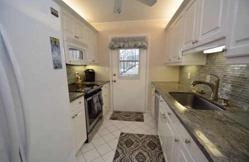 Moorings Condo | Prime Waterfront Location overlooking Moorings Bay. 7 minute walk to the beach