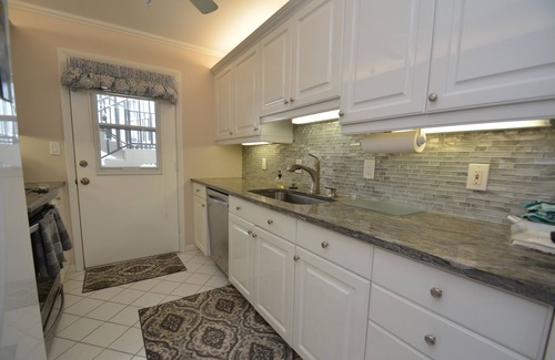 Moorings Condo | Prime Waterfront Location overlooking Moorings Bay. 7 minute walk to the beach