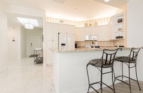 Vanderbilt Beach Condo | Regatta -Resort Style: 3BR/2BA -Lanai w/dining/conversational seating/pool view