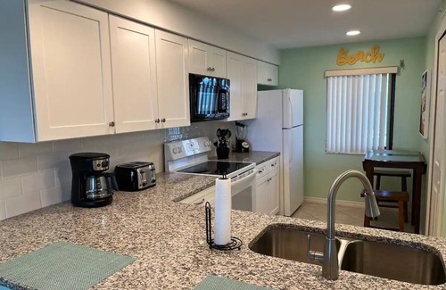Cocoa Beach Condo | Remodeled! Granite! Sandcastles 2 BR Direct Space Coast OCEANVIEW 704!