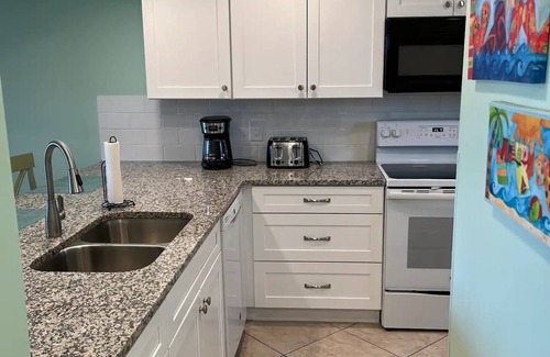 Cocoa Beach Condo | Remodeled! Granite! Sandcastles 2 BR Direct Space Coast OCEANVIEW 704!