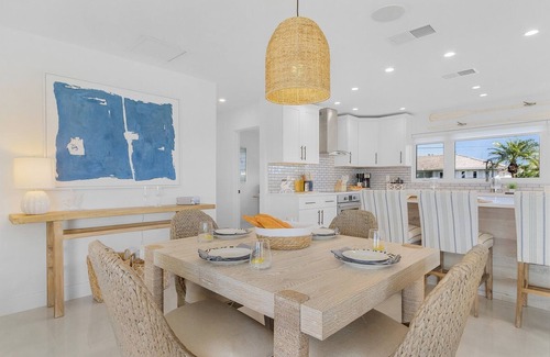 Yacht Club House | Renovated 3-bed, 2-bath home with pool, dock, bar, patio, and waterfront access.