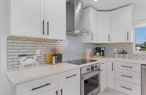 Yacht Club House | Renovated 3-bed, 2-bath home with pool, dock, bar, patio, and waterfront access.