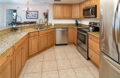 Pelican Bay Condo | Renovated Beachwalk 3 Bedroom Condo -5 minute walk to Beach!