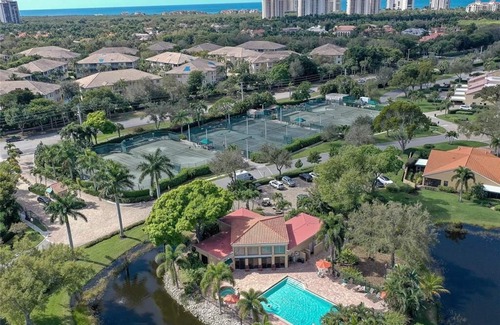 Pelican Bay Condo | Renovated Beachwalk 3 Bedroom Condo -5 minute walk to Beach!
