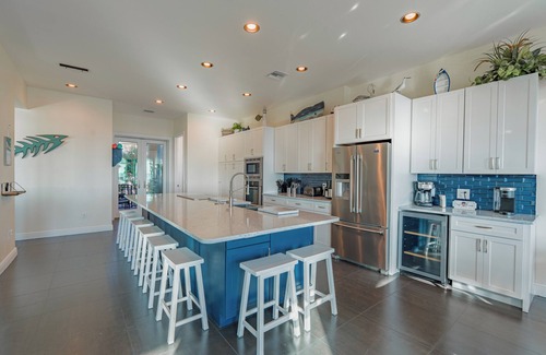 Mid Island House | Sabal Palms is a spectacular luxury pool home across from beach with Gulf view