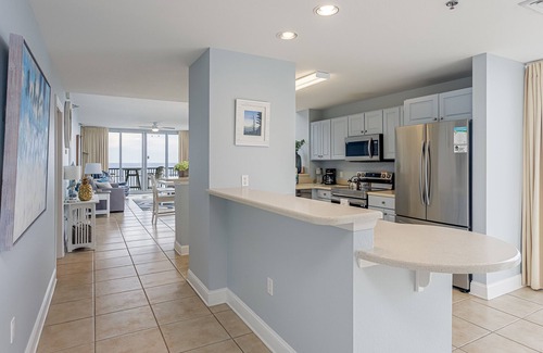 Pensacola Beach Condo | Spacious, open layout floor to ceiling with a wrap around balcony - ED1250