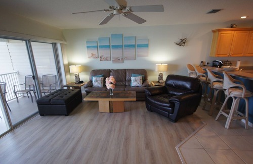 Indian Shores Condo | Sunrises and sunsets – finely appointed direct waterfront - steps from the beach