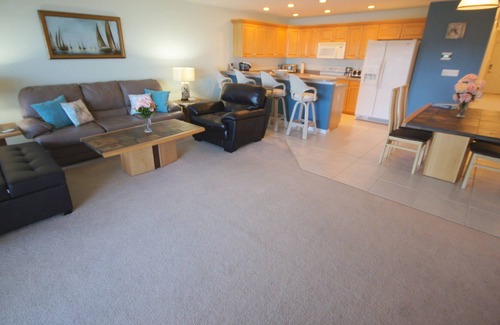Indian Shores Condo | Sunrises and sunsets – finely appointed direct waterfront - steps from the beach