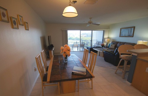 Indian Shores Condo | Sunrises and sunsets – finely appointed direct waterfront - steps from the beach