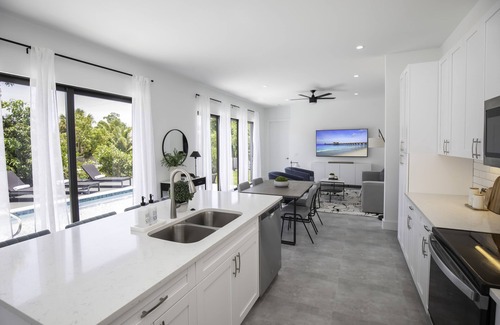 East Naples House | THE OASIS, Brand New Home, Screened in Heated Pool, Close to 5th Ave and Beach