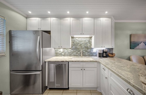 Brown Condo | Top-floor condo with ocean and pool views, private balcony, and multiple beachfront pools