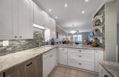 Brown Condo | Top-floor condo with ocean and pool views, private balcony, and multiple beachfront pools