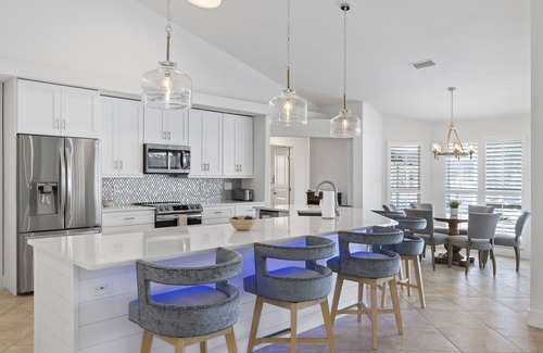 Pelican House | Unbeatable Direct Gulf Access Heated Pool Home with a Hot Tub and 6 bedrooms!