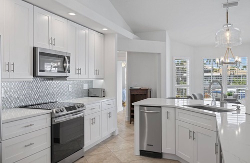 Pelican House | Unbeatable Direct Gulf Access Heated Pool Home with a Hot Tub and 6 bedrooms!