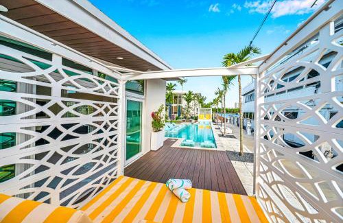 Coral Ridge Villa | Waterfront Compound 2 Heated Pools SaltAire Lime Keys