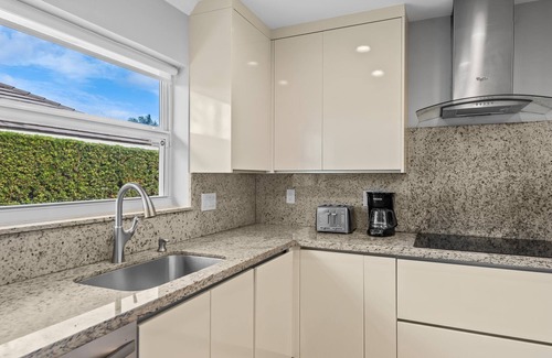 Lighthouse Point House | Waterfront~HUGE Heated Pool~Open Floor Plan~BIG Patio with Lots of Seating + Dock~Near Beaches