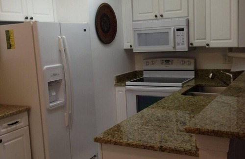 Central Naples Condo | World Tennis Club Condo, Lake View Gated Community