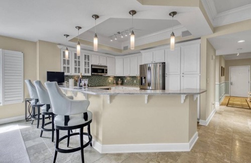 Panama City Beach Condo | 1/2 mile to Pier Park! Beautiful beachfront 3 BR, 3 BA Condo w/wrap around deck